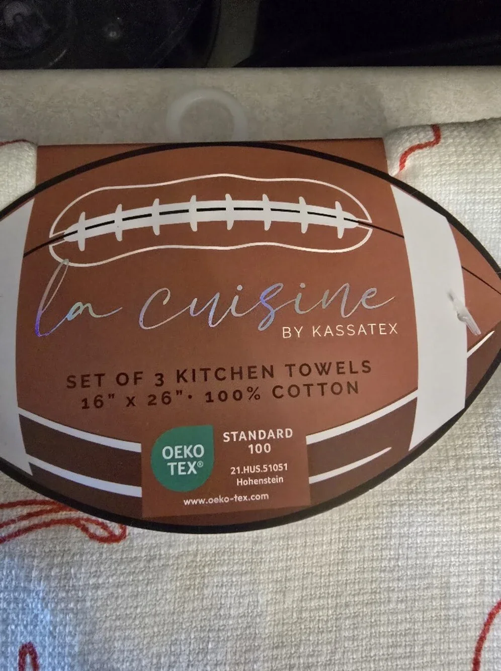 Kassatex White Kitchen Towel with Red Football Motif